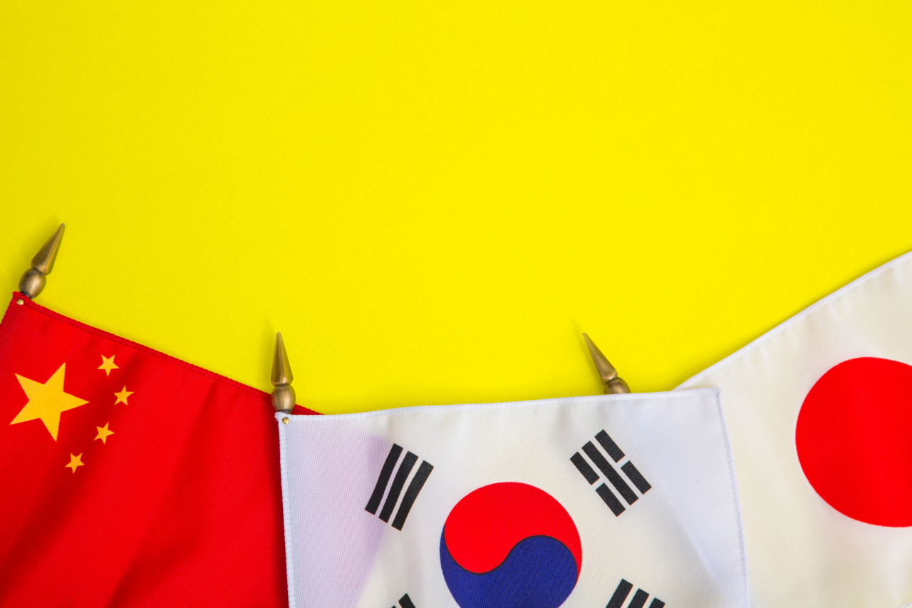 The flags of China, South Korea and Japan. (123rf)