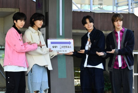 Members of 82Major pose for photos after casting a vote for the 22nd general election, April 5. (GREAT M Entertainment)