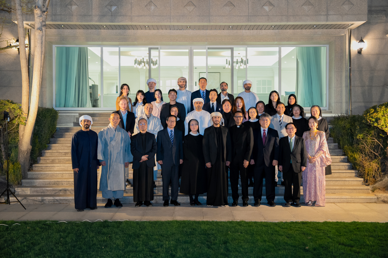 Attendees pose for a group photo at an event highlighting unity and tolerance at his residence in Yongsan-gu on March 31. (UAE Embassy in Seoul)