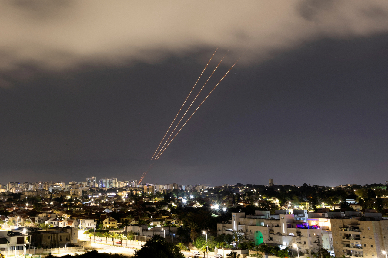 An anti-missile system operates after Iran launched drones and missiles towards Israel, as seen from Ashkelon, Israel April 14. (Reuters-Yonhap)