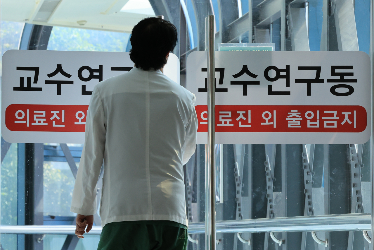 A medical school professor moves at a general hospital in Seoul on Monday. (Yonhap)