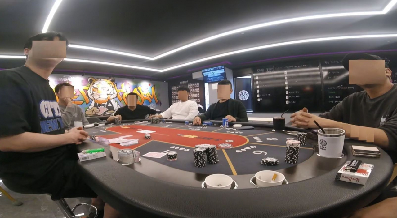 This photo distributed by the Incheon Seobu Police Station in December shows guests at a hold'em pub in Incheon that provided illegal gambling. (Incheon Seobu Police Station)