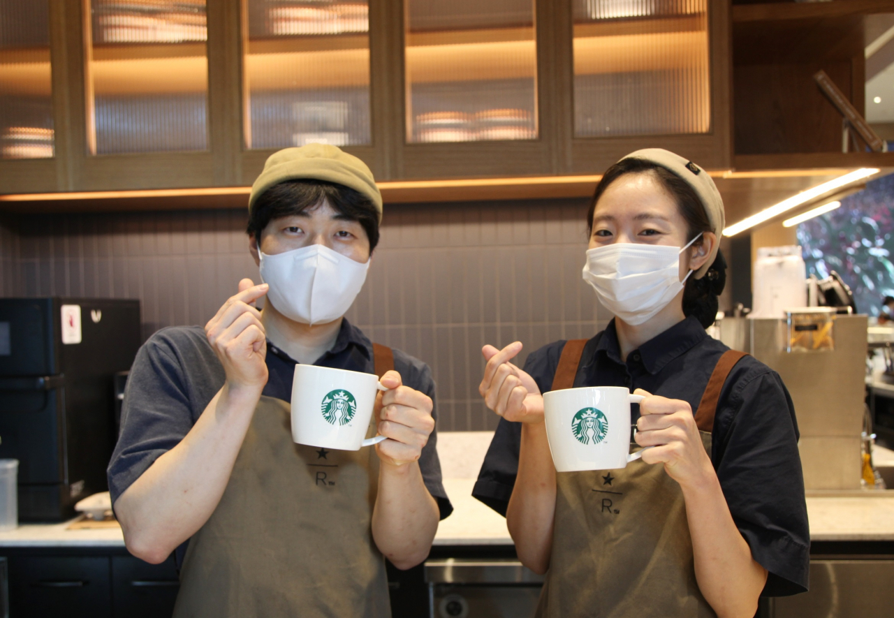 Starbucks Korea employees pose for a photo at a local branch in Seoul. (Starbucks Korea)