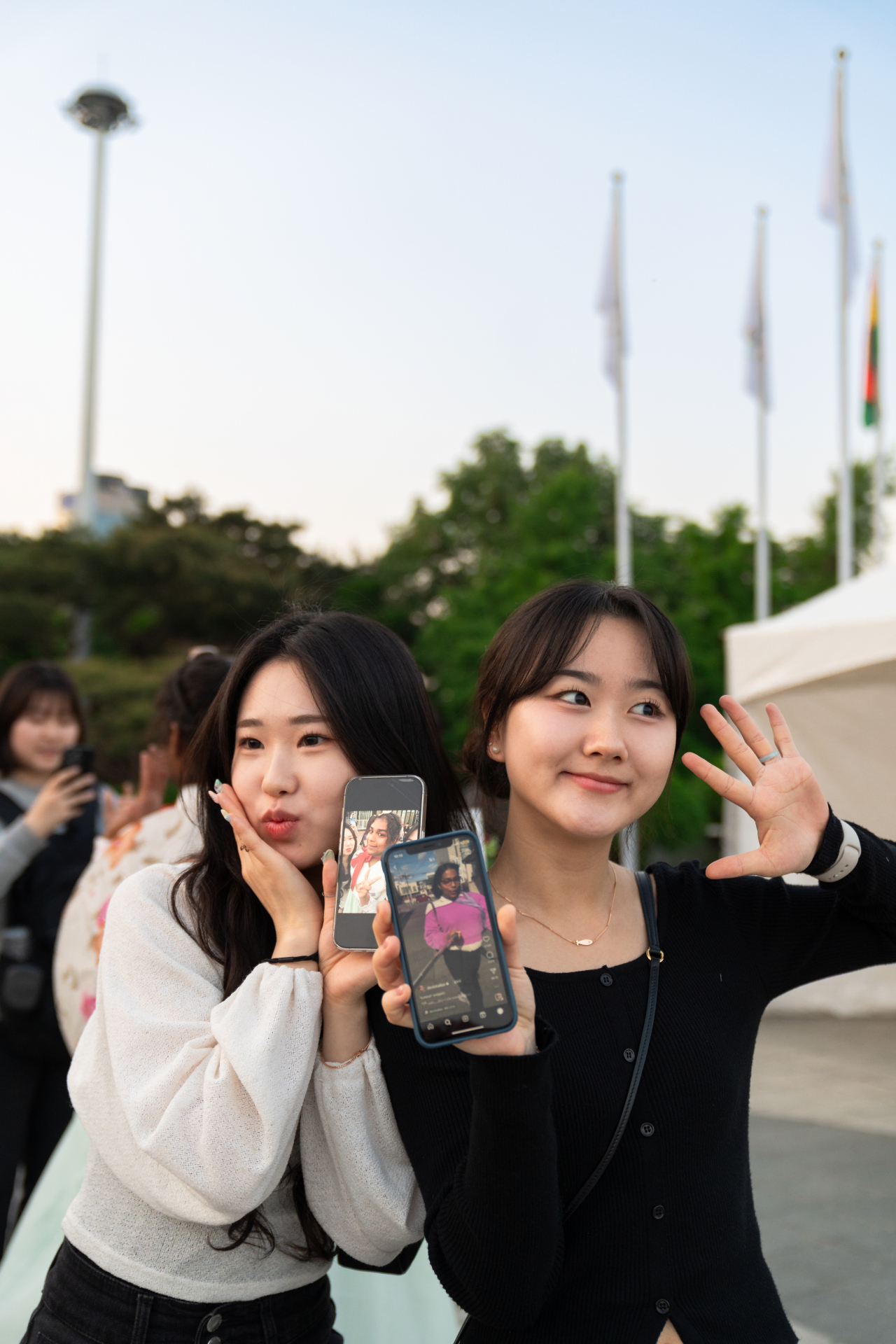 Young Korean fans, Kwon and Park, show The Korea Herald the 