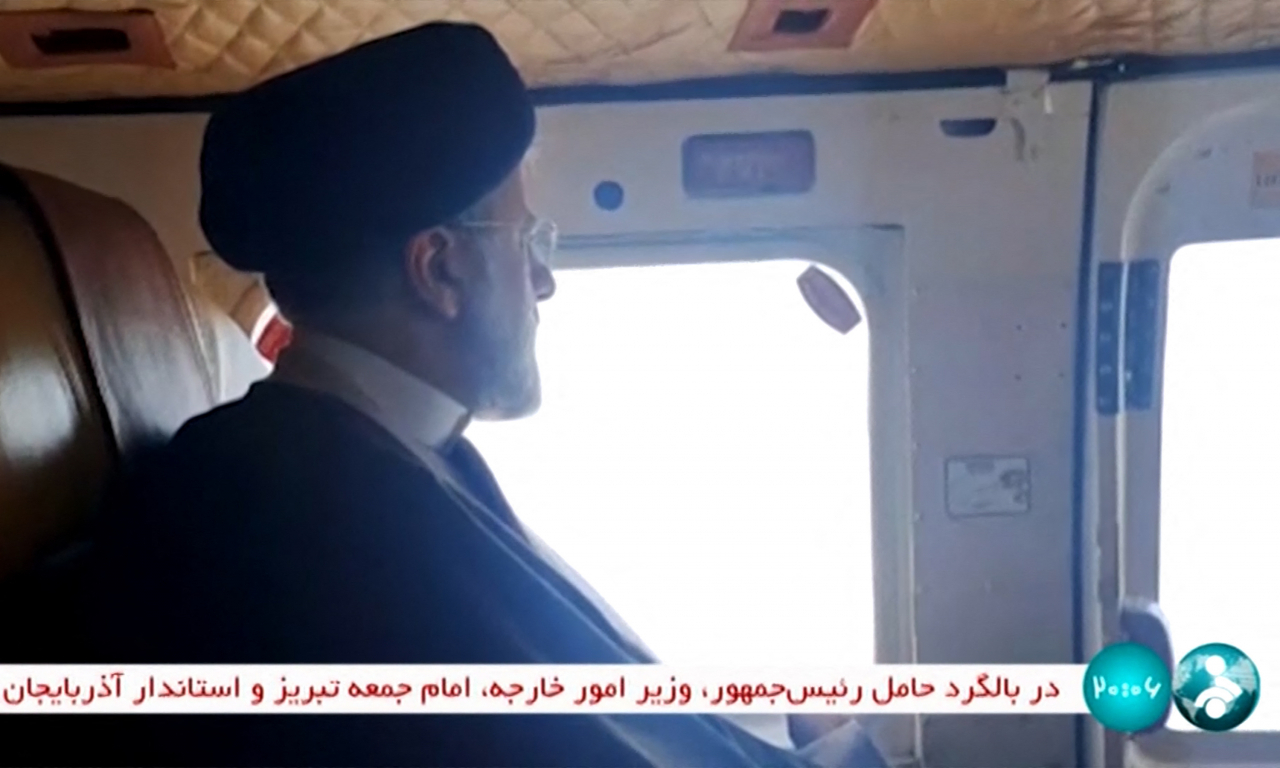 Iran's President Ebrahim Raisi on board a helicopter in the Jofa region of the western province of East Azerbaijan on Sunday (IRINN)