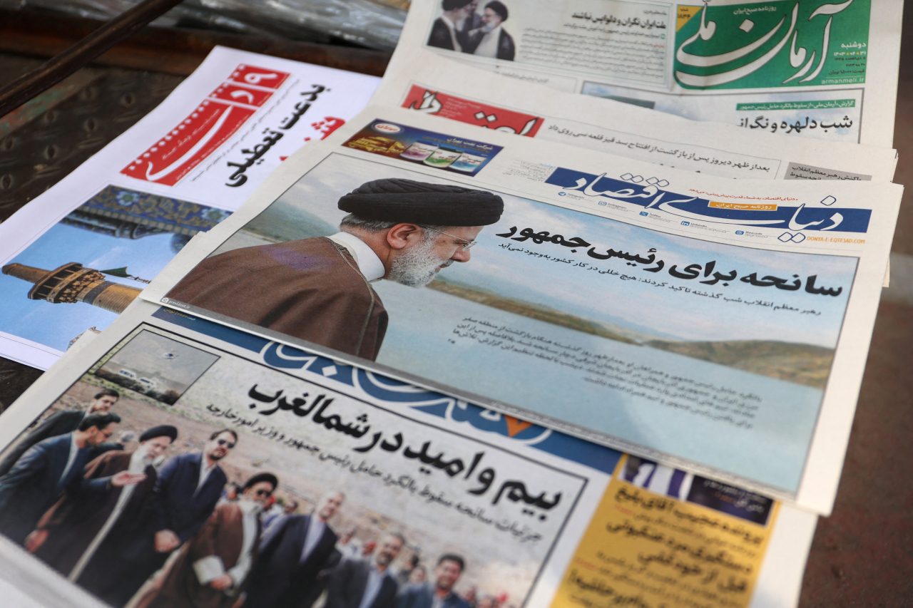 A newspaper with a picture of Iranian late President Ebrahim Raisi is seen in Tehran, Iran on Monday. (West Asia News Agency via Reuters)