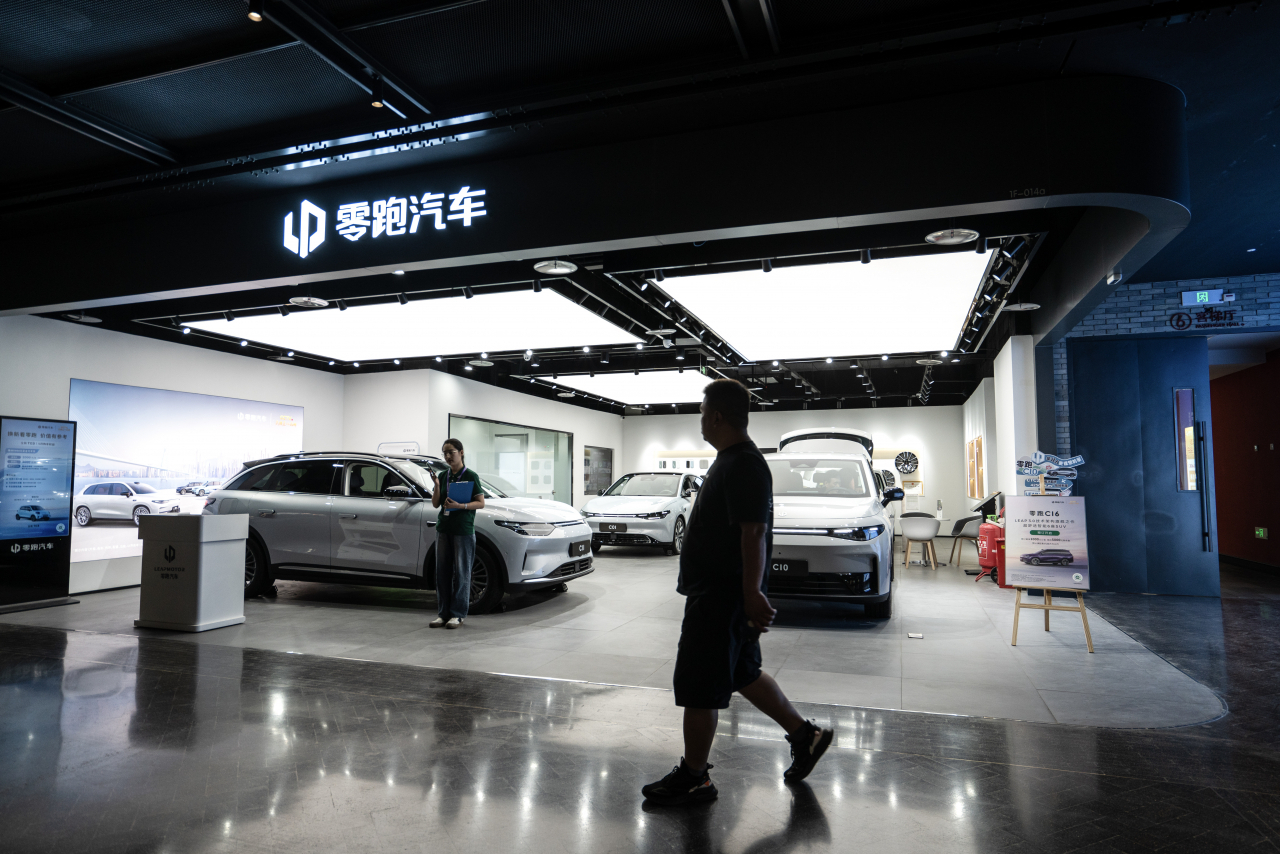 A man walks in front of a Leapmotor showroom in Beijing, China, Wednesday. The Biden administration on May 14 announced new tariff rates on 18 billion US dollar worth of Chinese imports. (EPA)