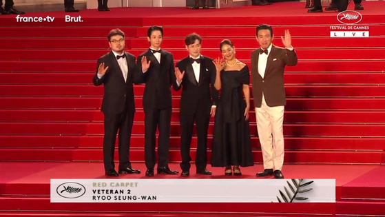 A team for “I, The Executioner” poses for a photo before the midnight screenings at the 77th Cannes Film Festival in Cannes, France, May 20. (Cannes Film Festival)