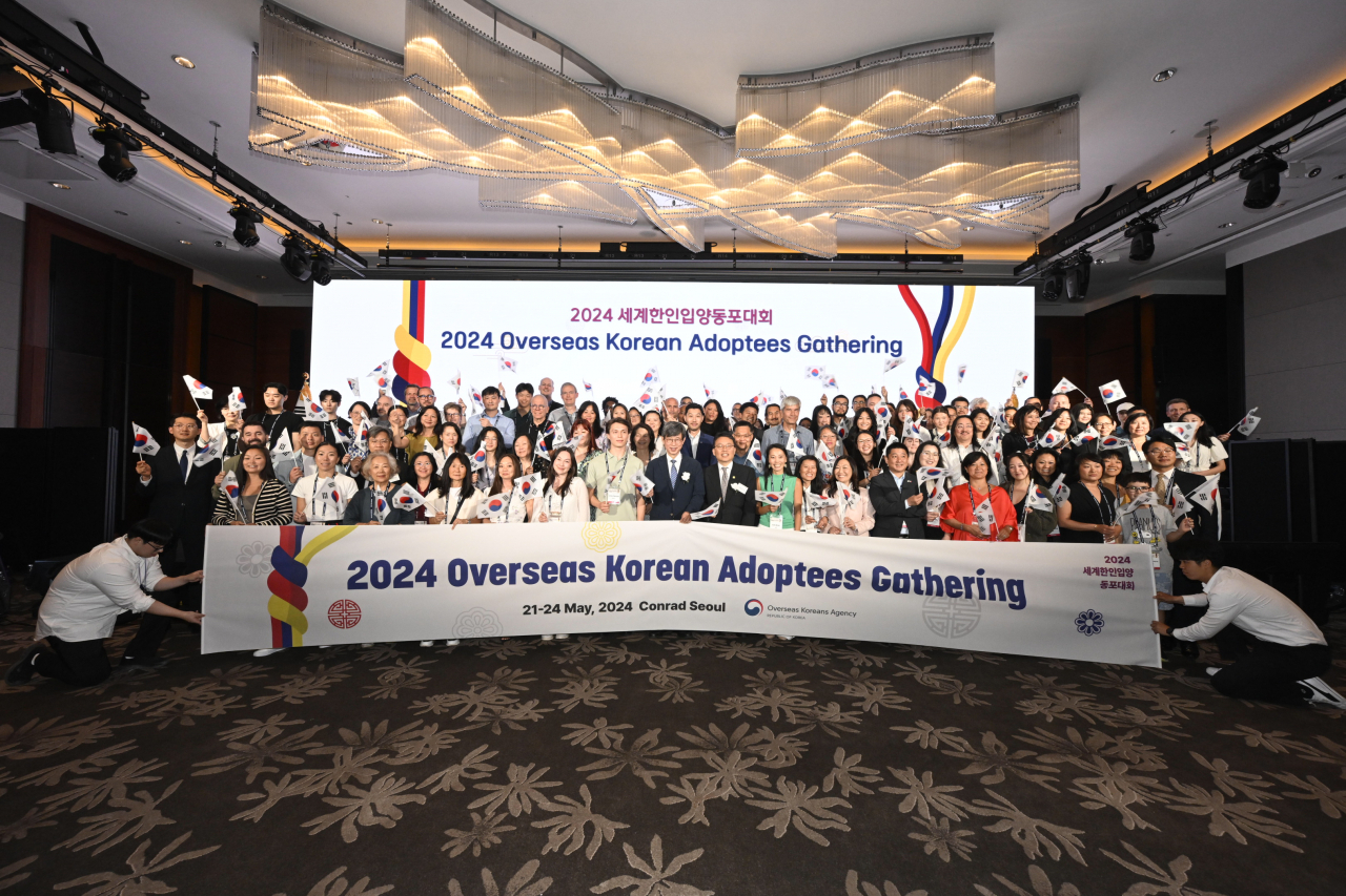 Participants in the 2024 Overseas Korean Adoptees Gathering pose after the opening ceremony at Conrad Hotel in Seoul, Tuesday. (Overseas Koreans Agency)