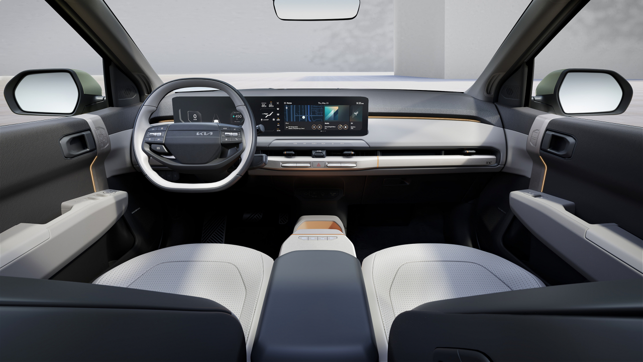 The EV3's interior features a spacious, two-tone cabin with a panoramic widescreen display. (Kia)