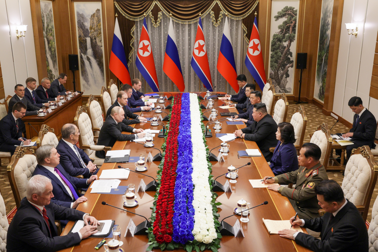 Russia's President Vladimir Putin (left, center) and North Korean leader Kim Jong-un (right, center) hold bilateral talks at the Kumsusan State Guest House. (Russian Presidential Press and Information Office via TASS)