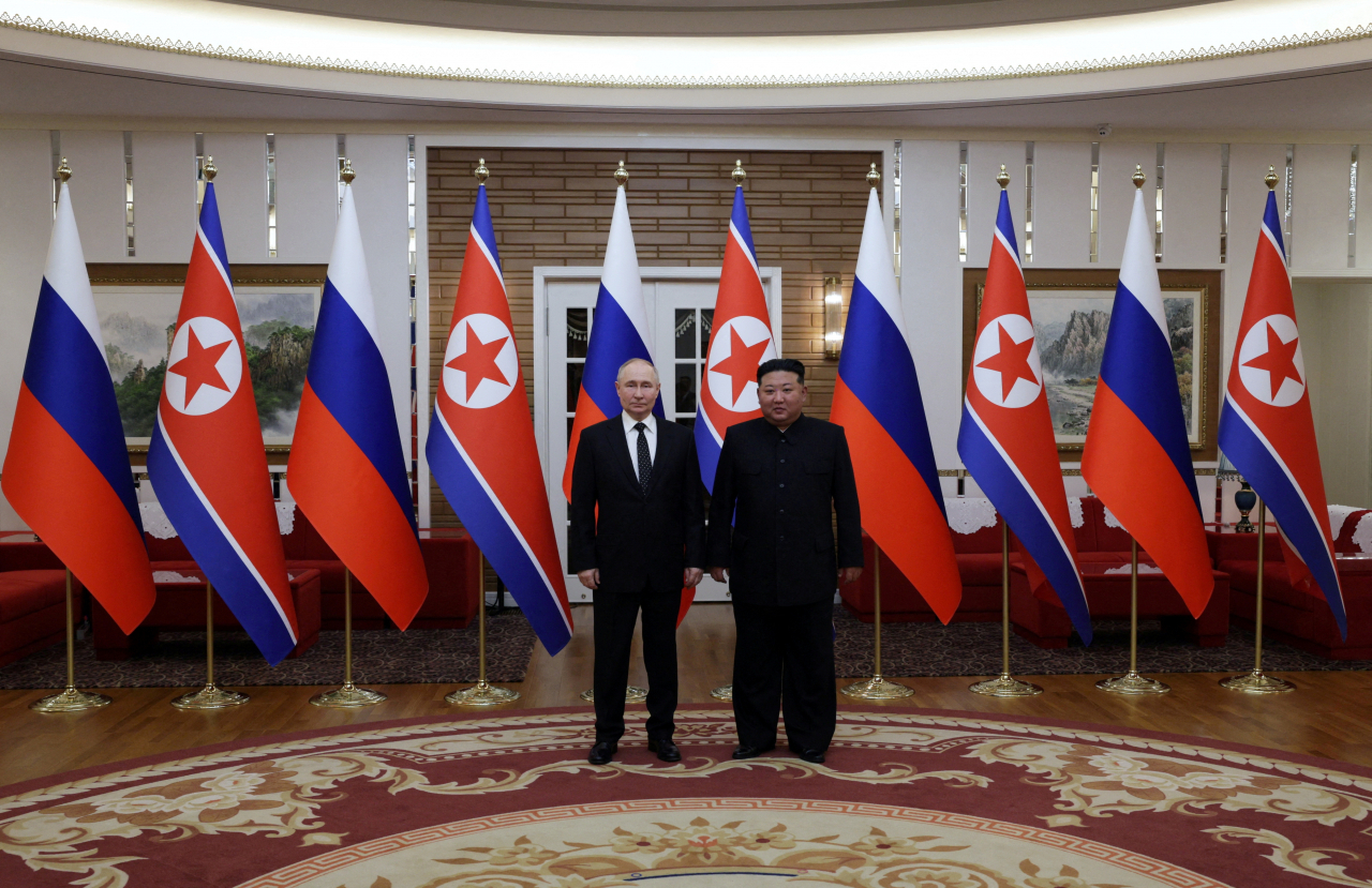 Russian President Vladimir Putin and North Korea's leader Kim Jong-un meet in Pyongyang, North Korea on Wednesday. (Reuters-Yonhap)