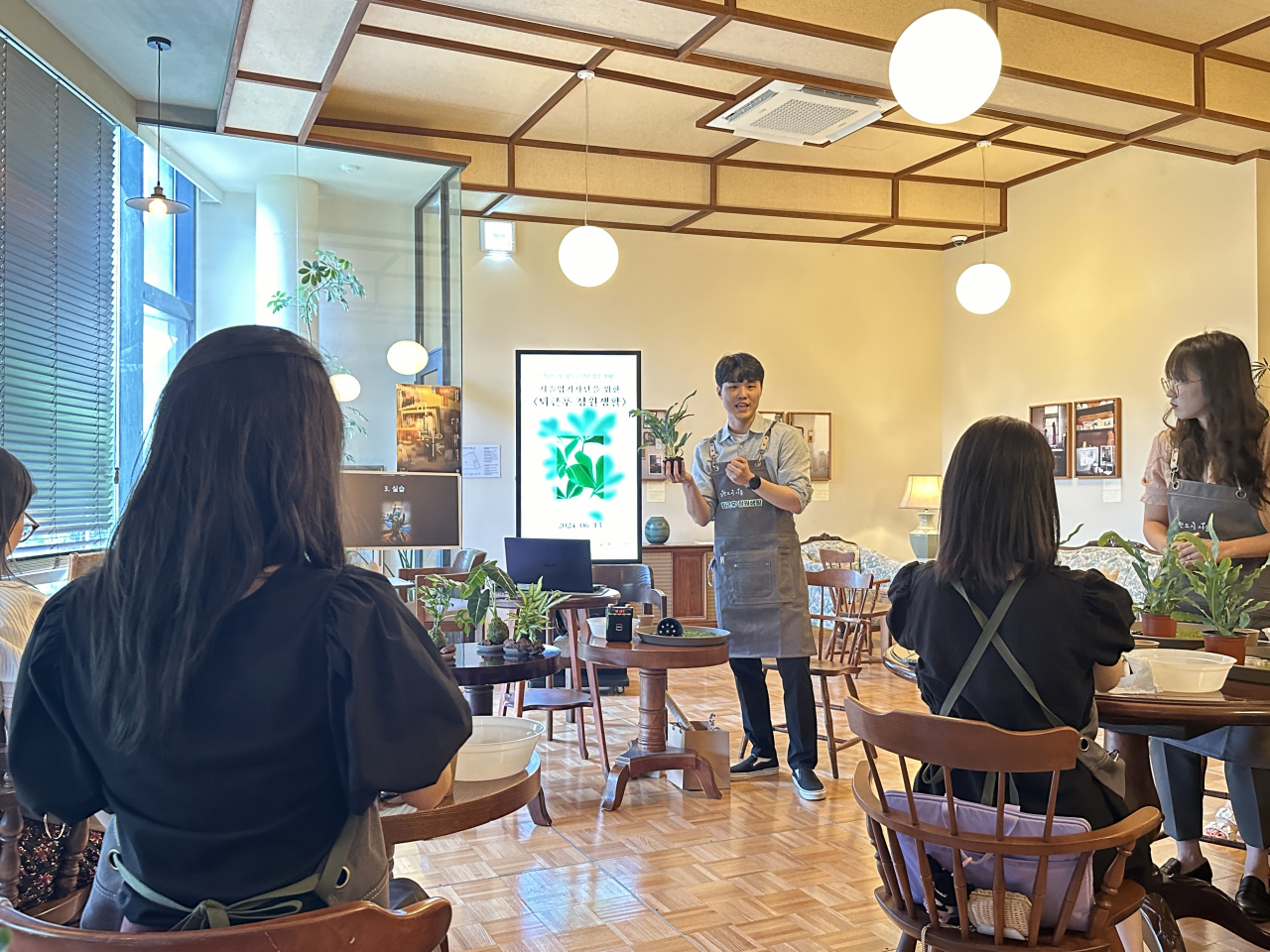 Park Geon, a gardener, conducts gardening classes at a cafe in Seoul as part of the Seoul Metropolitan Government's 