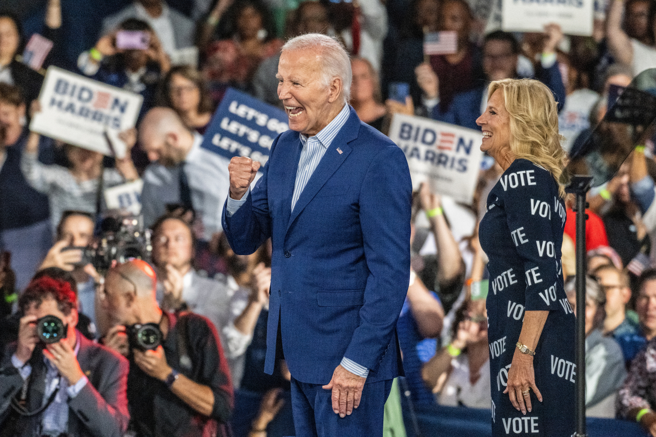 US President Joe Biden and First Lady Dr. Jill Biden react to the crowd during a campaign event at the Jim Graham Building at the North Carolina State Fairgrounds in Raleigh, North Carolina, US, Friday. (EPA-Yonhap)