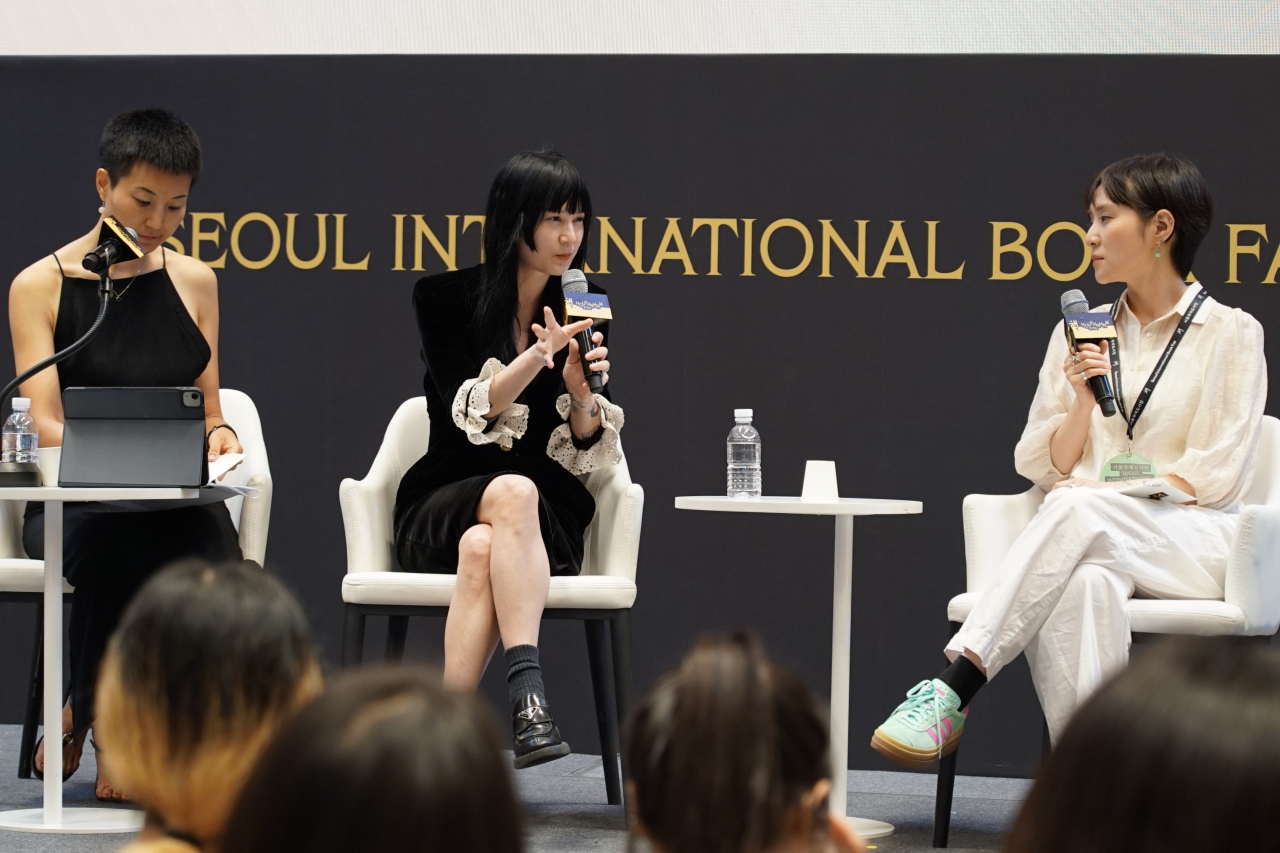 Michelle Zauner (center) speaks at a talk at the Seoul International Book Fair, held at Coex, on Thursday. (Hwang Dong-hee/The Korea Herald)
