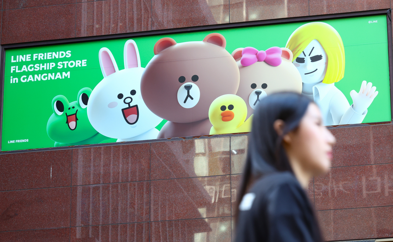A pedestrian passes the Line Friends flagship store in southern Seoul. (Newsis)