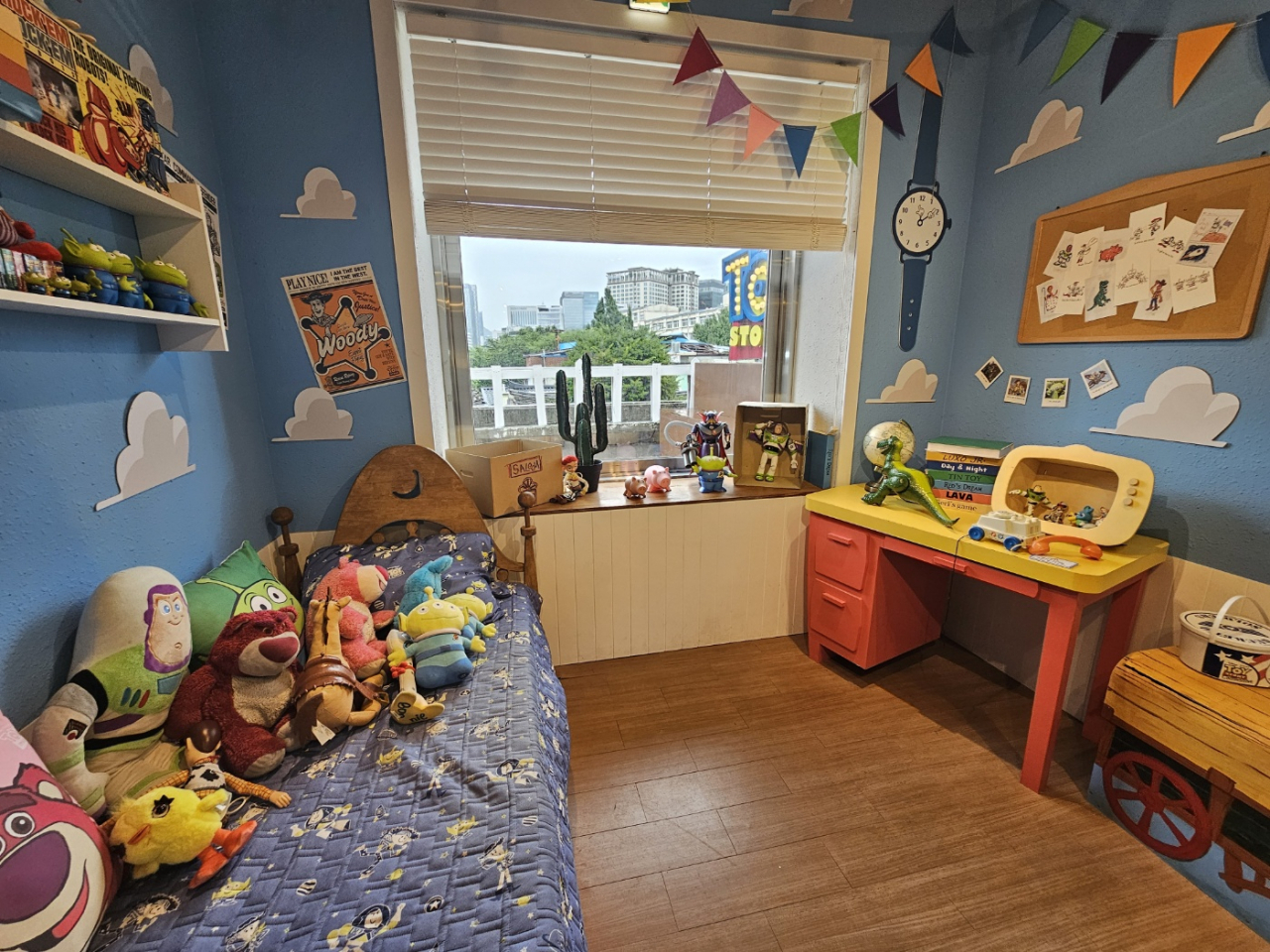 A photo zone at Pixar House featuring a real-life replica of Andy's room from 