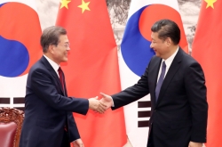Moon, Xi vow no war on Korean Peninsula
