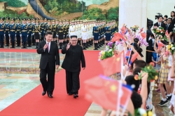 Kim, Xi discuss denuclearization, pledge closer cooperation