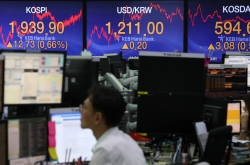 Seoul stocks open lower on US losses, WHO declaration