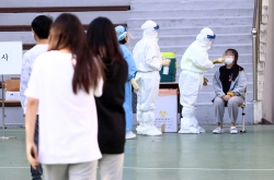 S. Korea’s daily COVID-19 cases back in triple digits
