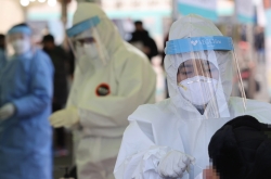 New virus cases under 1,000, tougher pandemic rules under consideration