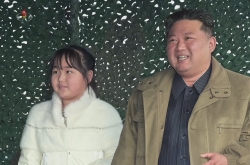 Kim Jong-un revealing daughter for first time shows his confidence, experts say