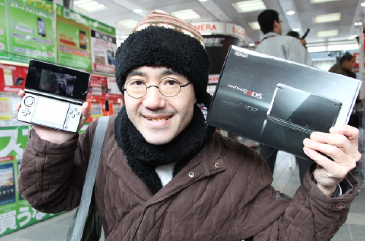 Nintendo 3-D handheld goes on sale in Japan
