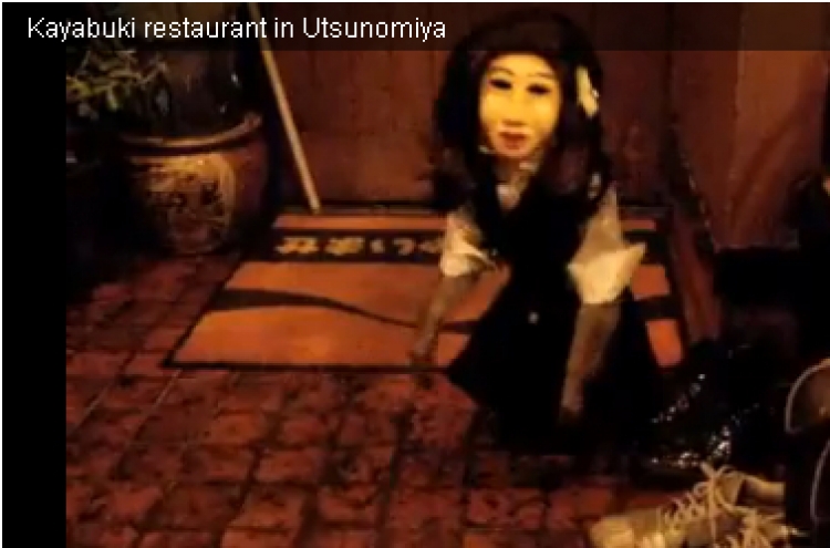 Waitress monkey wearing a ‘Japanese doll’ mask still a massive hit on YouTube