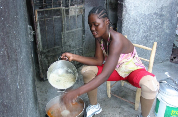 Quake victim is standing tall again in Haiti