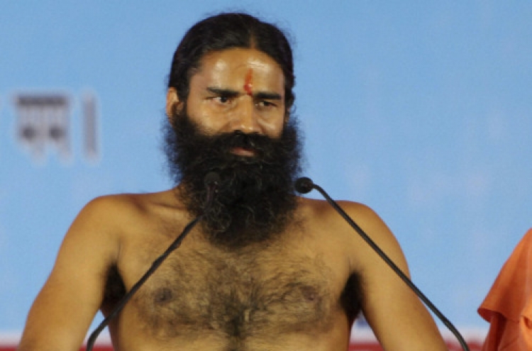 Police break up yoga guru’s hunger strike