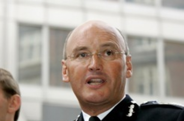 British police chief quits over phone-hacking scandal