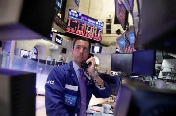 Stocks in U.S., Europe slide as Treasuries rally