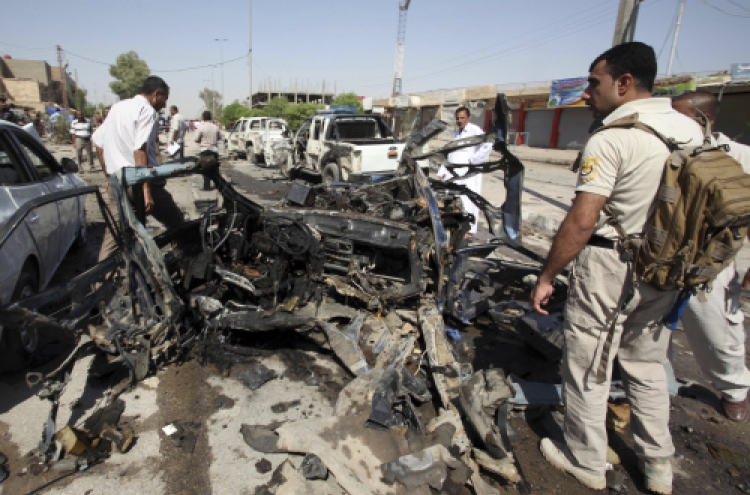 Bombs tear through 17 Iraqi cities, 63 killed