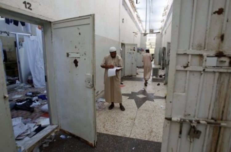 Liberated inmates tell of 'dark age' under Gadhafi