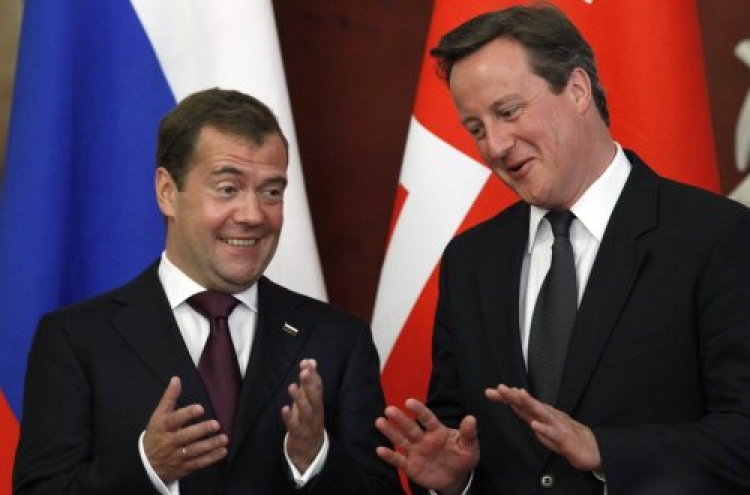 Cameron urges U.K., Russia to mend trade ties