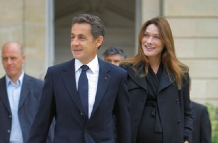 Sarkozy‘s flower power won over Bruni