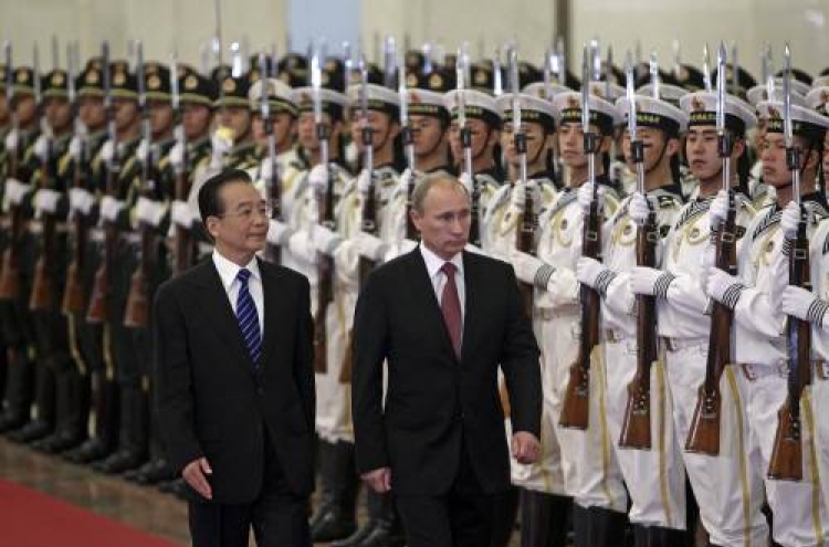 Russian PM Putin in China seeking closer ties