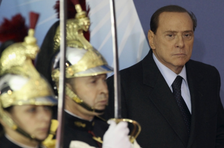 Italy's Berlusconi to resign after reforms pass