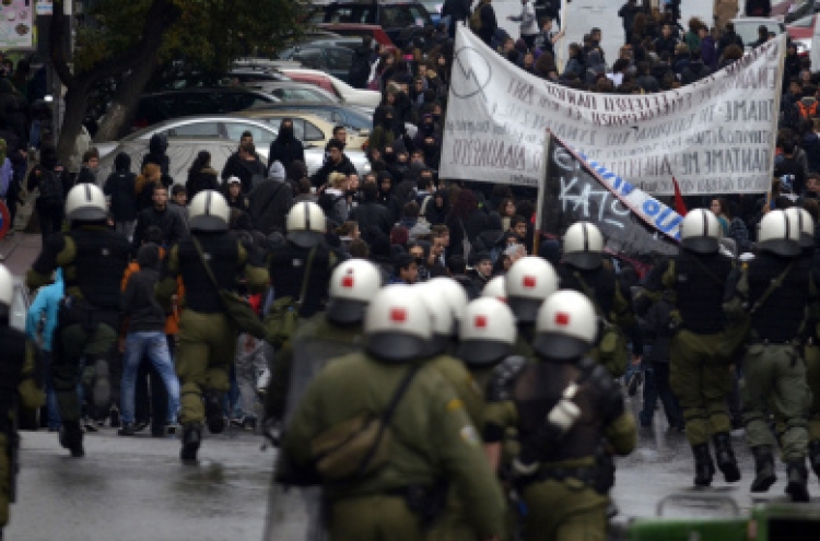 Greece passes austerity budget after clashes