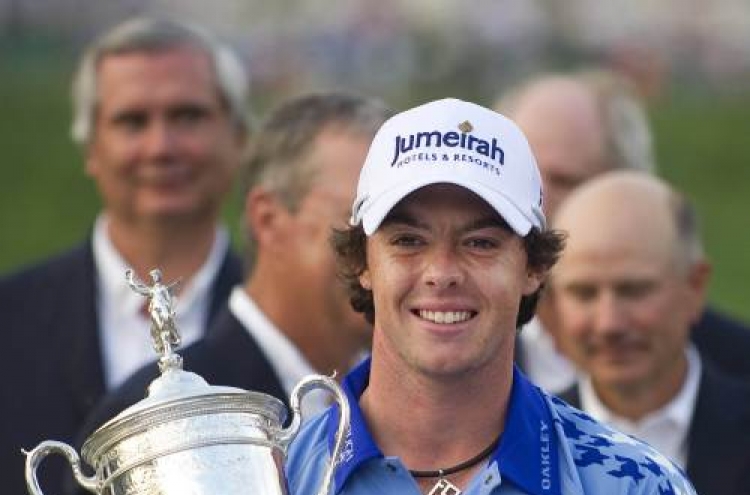 Clarke, McIlroy honored by Queen after major wins