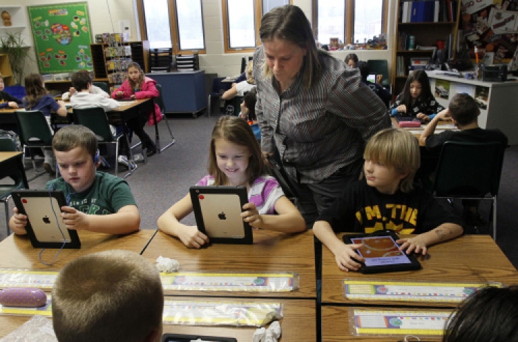 Students learn with donated iPads