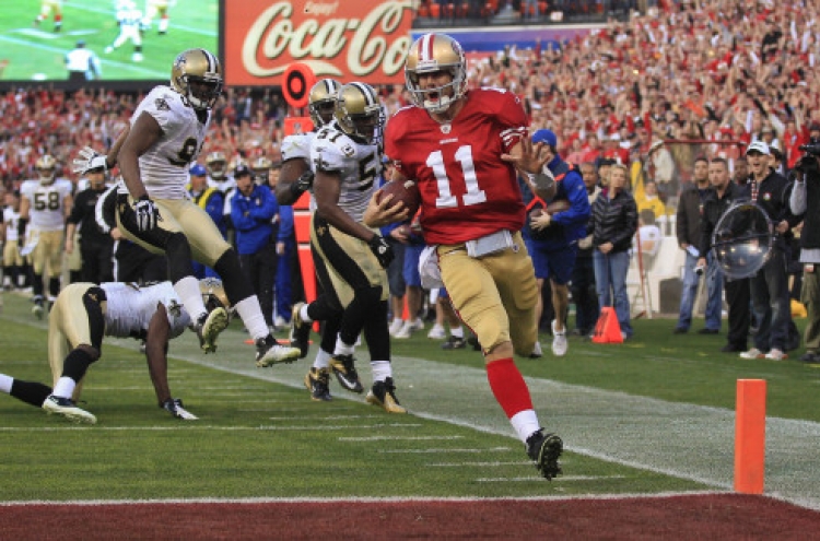 Smith, 49ers rally twice to stun Saints