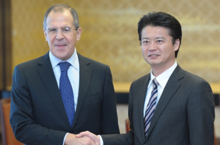 Japan, Russia to boost ties despite islands row