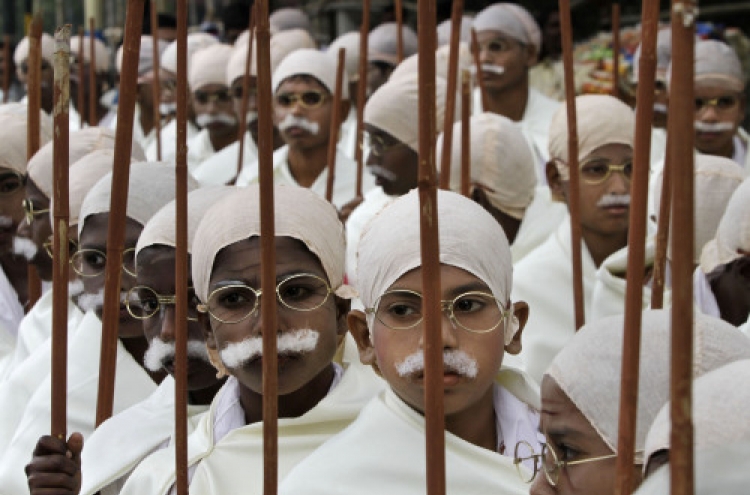 Underprivileged Indian children rally in Gandhi costumes