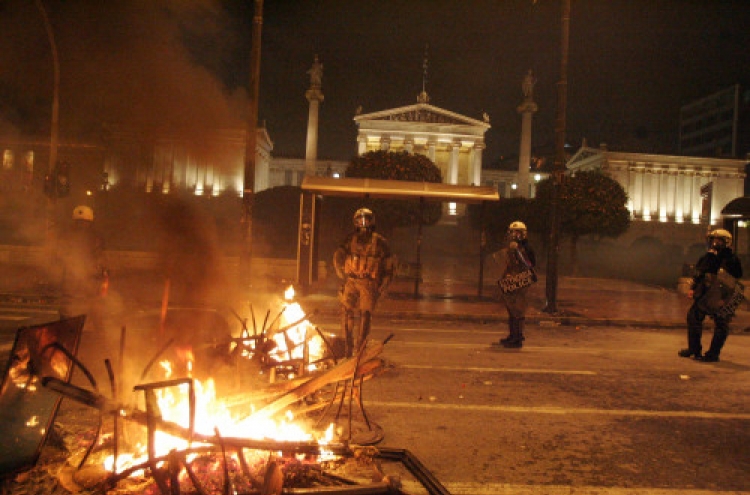 Greece passes austerity deal amid rioting