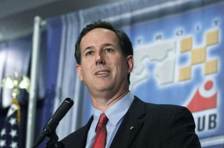 Santorum challenges Romney in Detroit