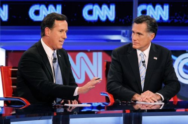 Romney pounces on Santorum in 20th debate