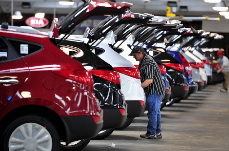 Detroit automakers race to keep up with sales