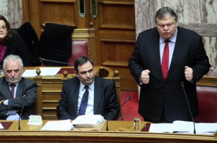 Greece approves more budget cuts for bailout